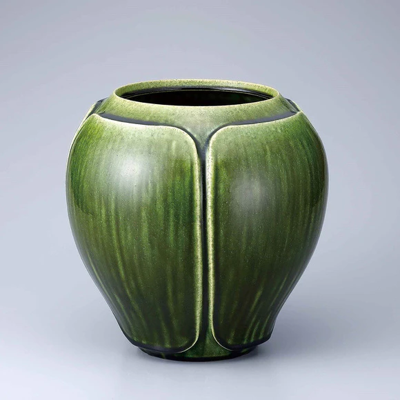 Flower vessel with green glaze.