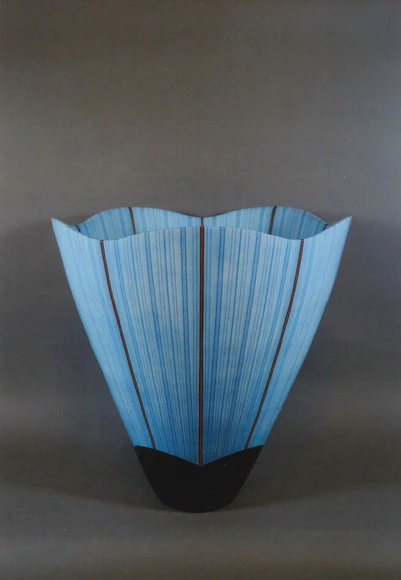 Vessel with hazy blue glaze and stripe pattern