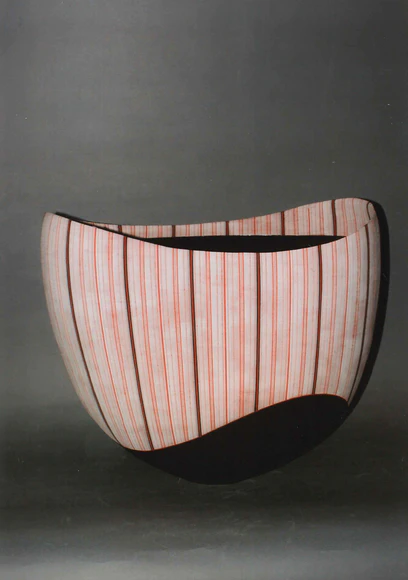 Vessel with hazy glaze and stripe pattern
