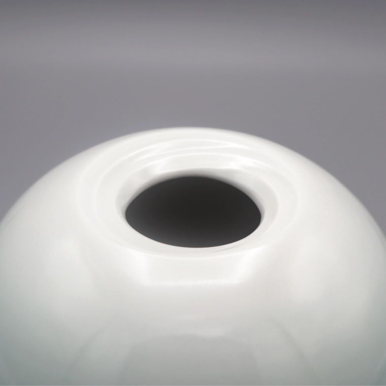 photo White Porcelain Jar with Pale Blue Glaze and Whirlpool Design