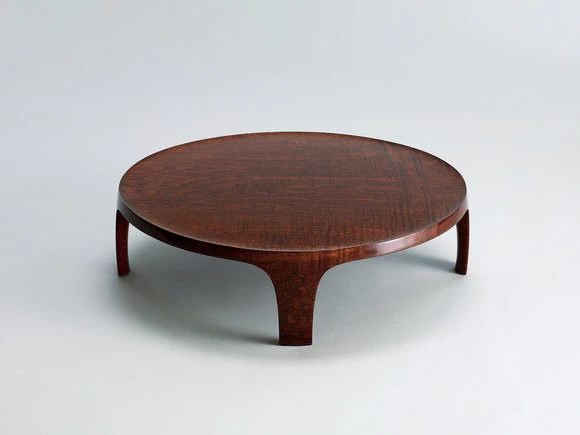 Round low table of Japanese raisin wood coated with urushi.