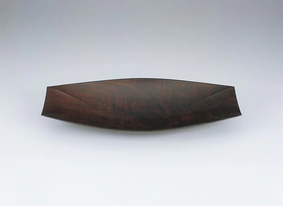 Bowl of claro walnut coated with urushi.