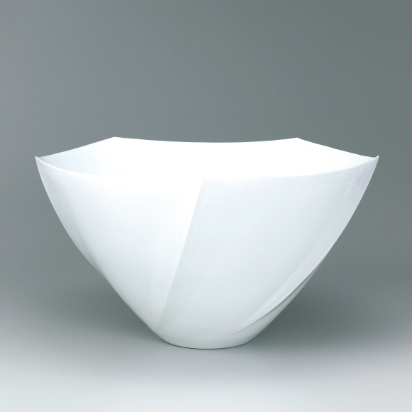 White porcelain faceted flower vessel.