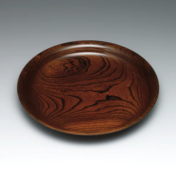 Food vessel of zelkova wood finished in wiped urushi.