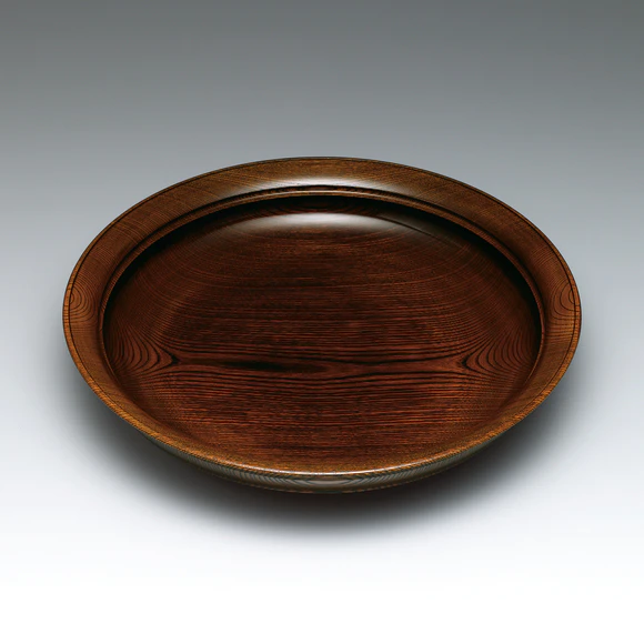 Vessel of zelkova wood finished in wiped urushi.