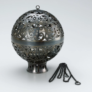 Spherical incense burner of black bronze with gold inlay. “Two worlds”