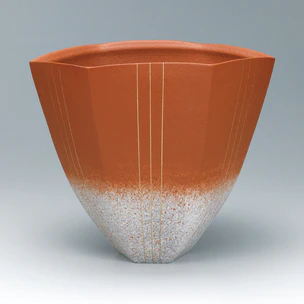 Hexagonal vessel with sprayed slip and gold line decoration.
