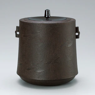 Tea ceremony kettle in shape of hanging bell with bamboo leaf design.