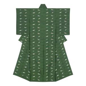 Kimono of tsumugi with “picture” kasuri. “Water and sky merge into one blue color”
