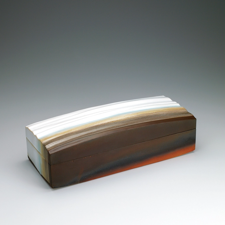 photo Rectangular box with white glaze, fire marks and wave design.