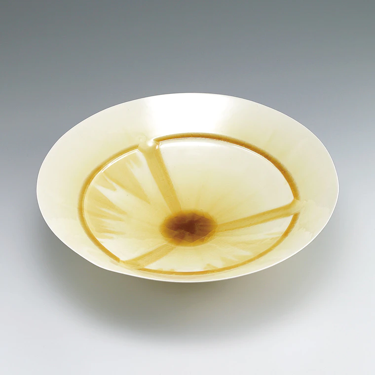 photo Large bowl with yellow glaze and ridged slip line.