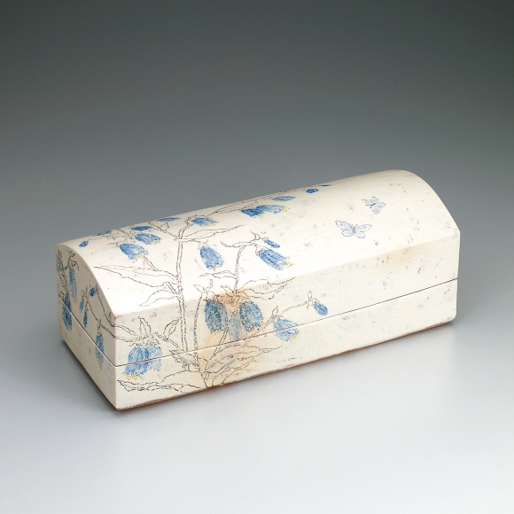 Box with bellflower design in chalk drawing.