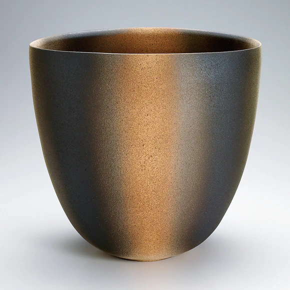 Flattened jar with layered glaze.