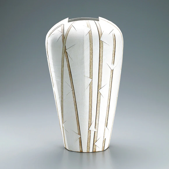 Jar of irregular shape with colored slip decoration.