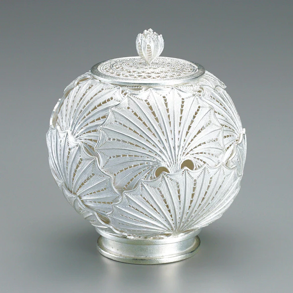 Incense burner of silver wire. “Bog rhubarb”