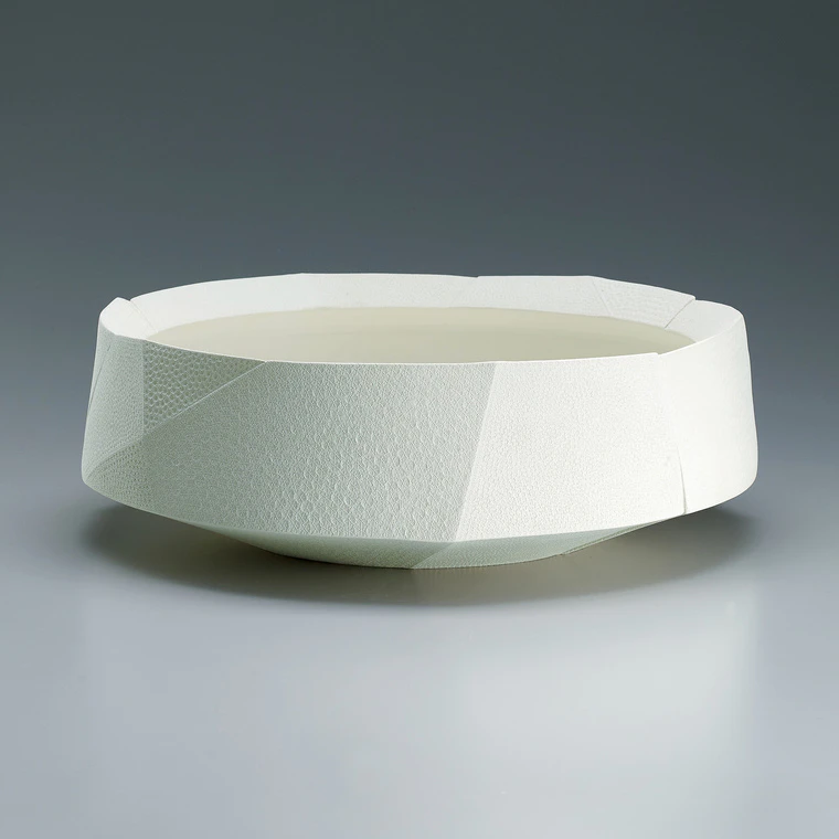 photo Vessel with pressed dot decoration. “Snow”
