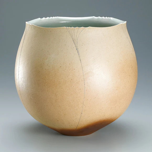 Flower vessel with line design in underglaze painting.