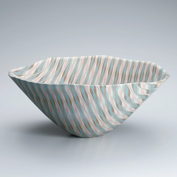 Octagonal marbled bowl with bamboo leaf design.