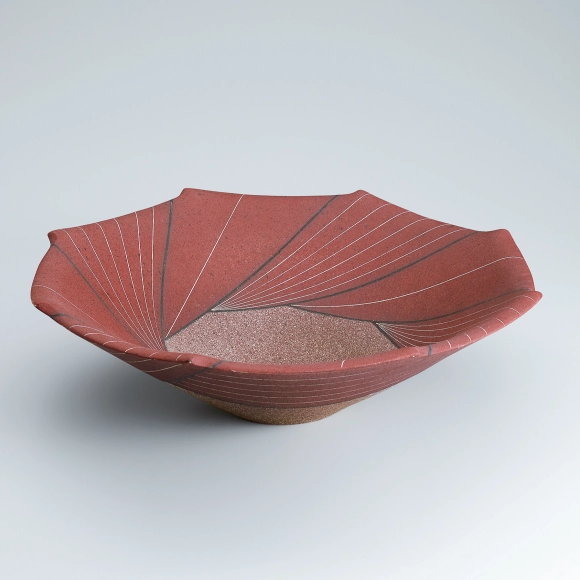 Bowl with sprayed colored slip and geometrical design.