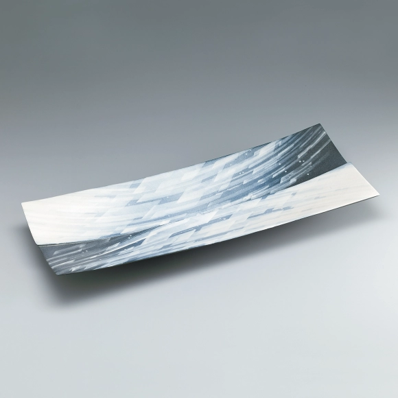 Rectangular dish with stream design in white slip.