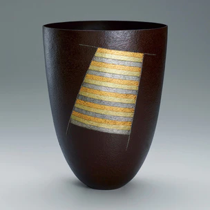 Flower vessel of forged iron with design in gold and silver inlay. “Summer breeze”