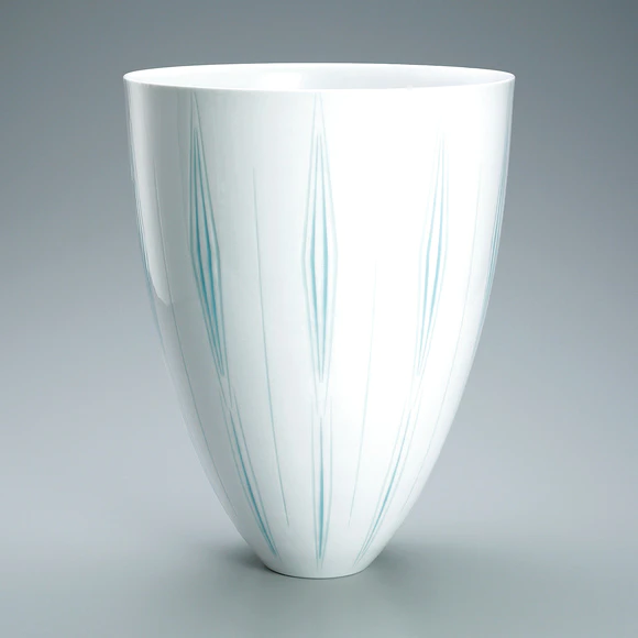 Flower vessel with glaze inlay and engraved decoration.