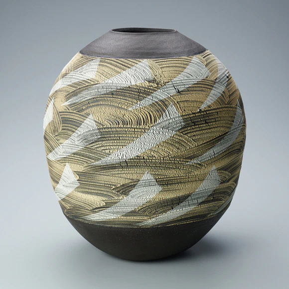 Jar with ocean wave design in hakeme brush marks.