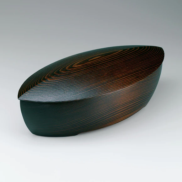 Boat-shaped box of cedar wood made by scooping out method and polished with sand.