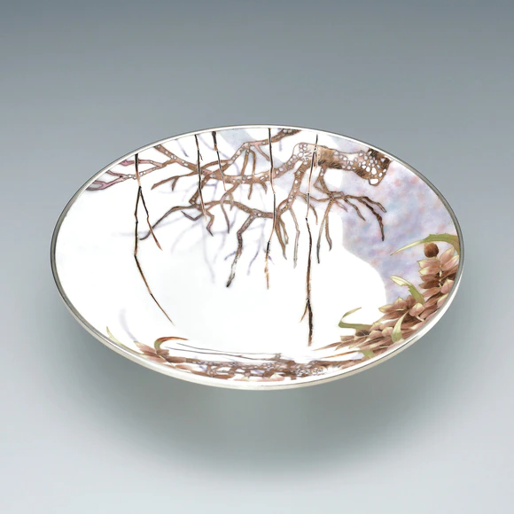 Cloisonne dish with grass and tree design. “Life survives in withered garden”