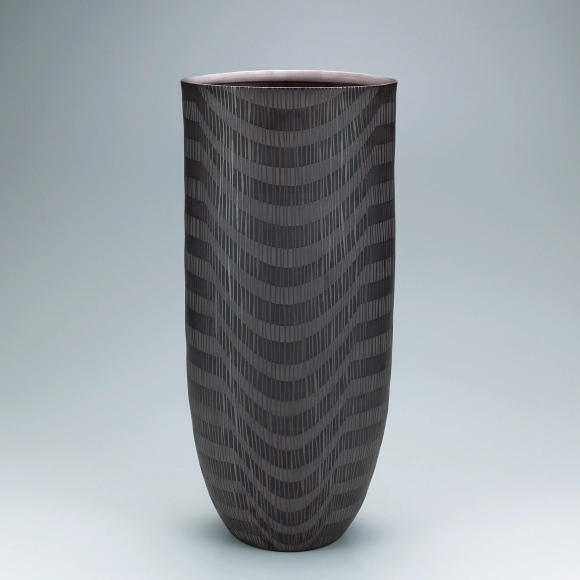 Banko flower vessel with engraved decoration.
