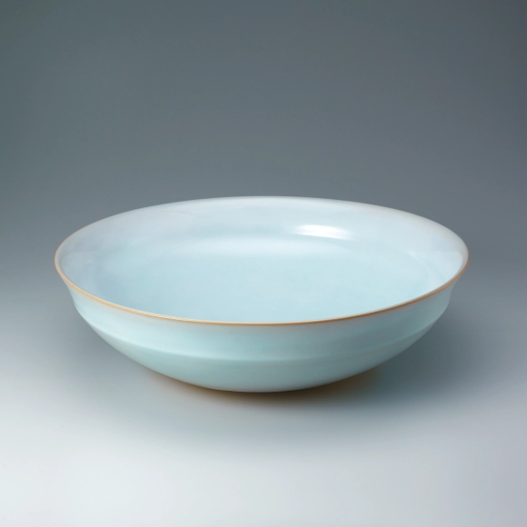 Bowl with pale blue glaze.