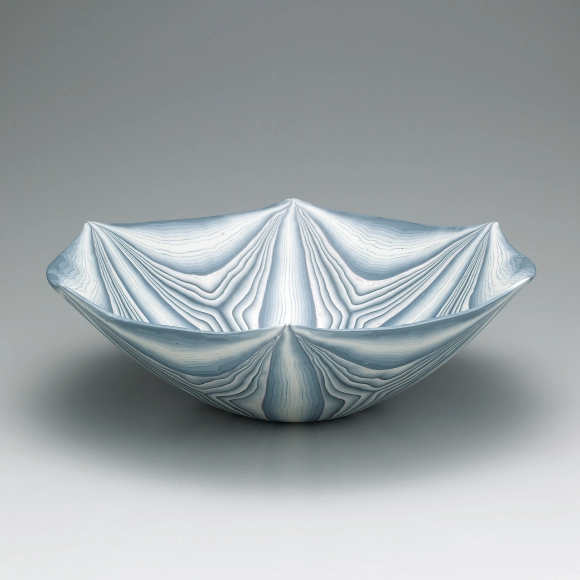 Large marbled bowl with pointed rim.