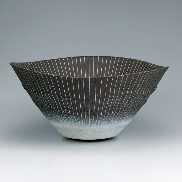 Bowl with colored slip, overglaze enamel and inlay decoration.