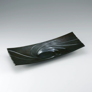 Plate of rōgin cast in lost wax casting method. “Suck”