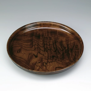 Food vessel of zelkova wood finished in wiped urushi.