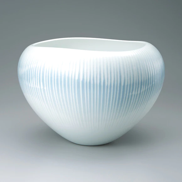 Deep bowl with luster colored glaze decoration. “So”