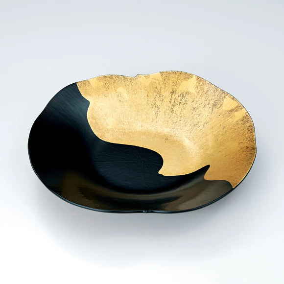 Kanshitsu food vessel in shape of lotus leaf with gold decoration.