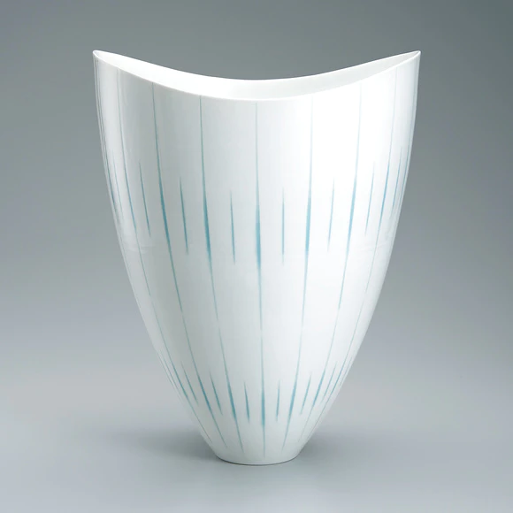 Flower vessel with glaze inlay and engraved decoration.