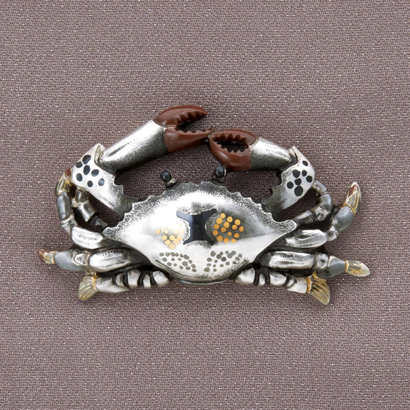Metal fitting in shape of Japanese blue crab.