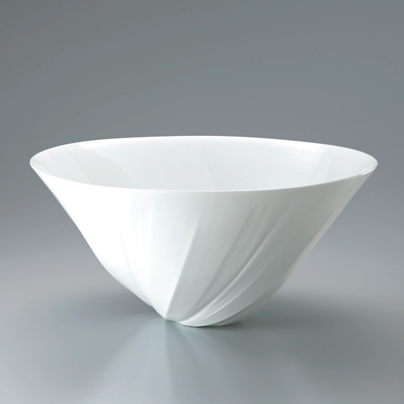 White porcelain faceted flower vessel with engraved line decoration.