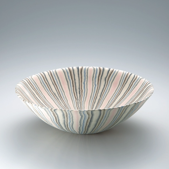Large marbled bowl with lobed rim.
