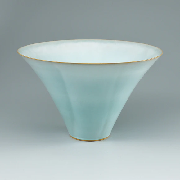Flower vessel with pale blue glaze.
