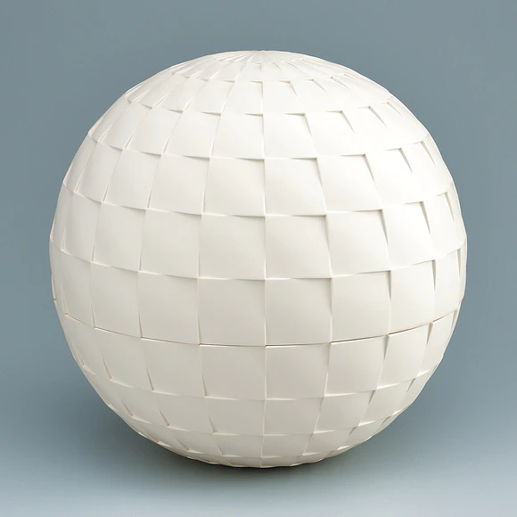 White globular covered vessel. “Sun”