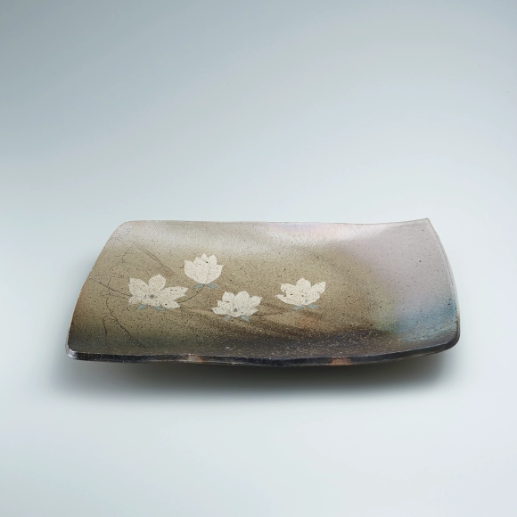 Dish with picture decoration covered with ash