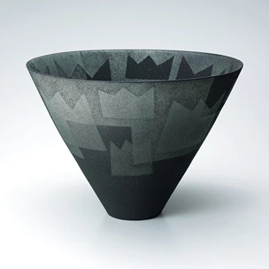 Flower vessel with delineated geometrical design.