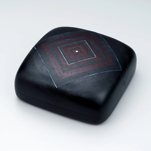 Square covered food box of shitai with wrinkled surface.