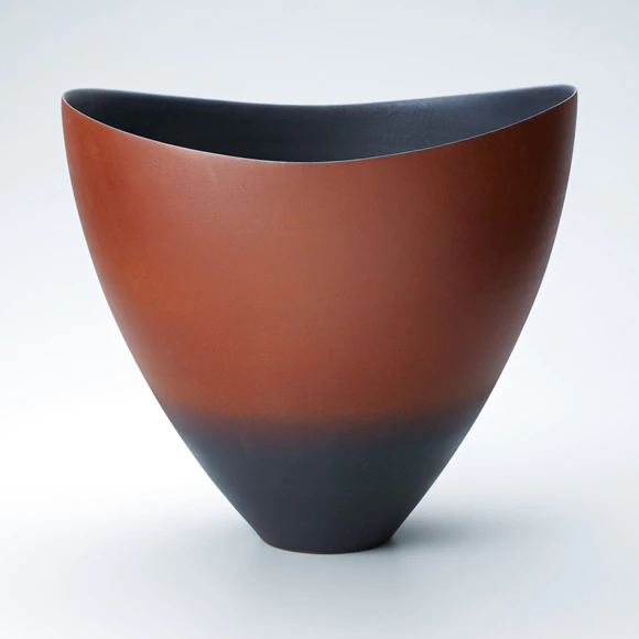 Flower vessel with red glaze.