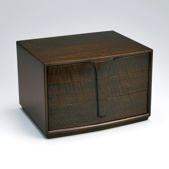 Small chest of drawers of black walnut finished in wiped urushi.