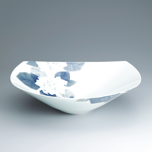 Squarish bowl with carved and underglaze blue design. “Hydrangea”