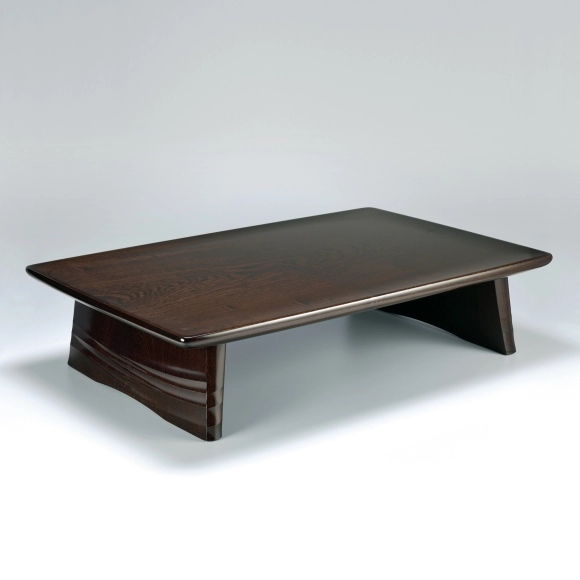 Low table of zelkova wood with wave design finished in wiped urushi.